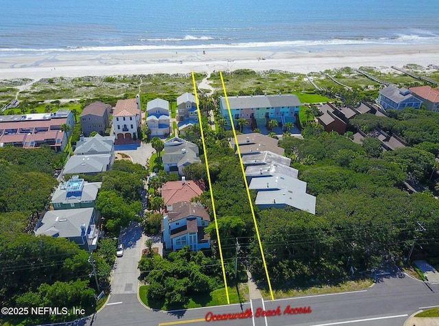 aerial view of residential area featuring expansive beach and property parcel outlined