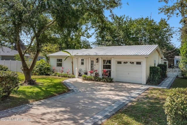 120 Swallow Rd, Saint Augustine, FL 32086 - single story home with a garage, concrete driveway, and metal roof