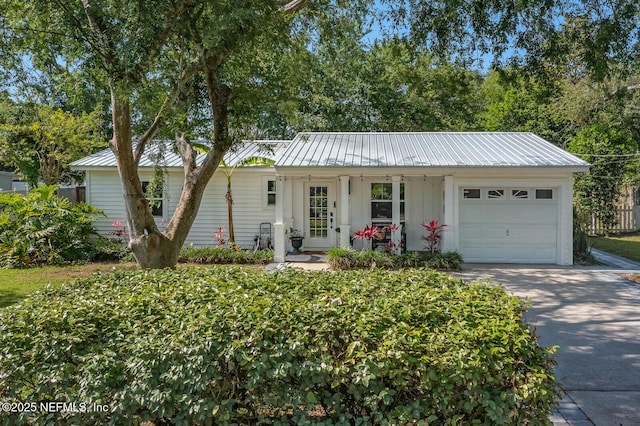 120 Swallow Rd, Saint Augustine, FL 32086 - single story home with an attached garage, concrete driveway, and metal roof