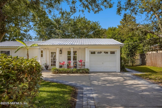 120 Swallow Rd, Saint Augustine, FL 32086 - ranch-style house with concrete driveway, fence, a garage, and metal roof