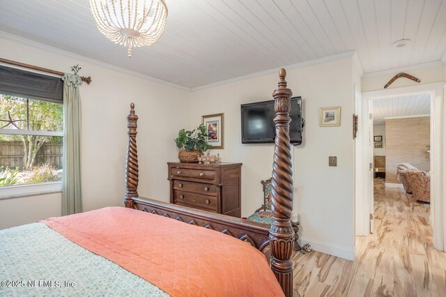 120 Swallow Rd, Saint Augustine, FL 32086 - bedroom featuring wood finished floors, baseboards, crown molding, and a chandelier