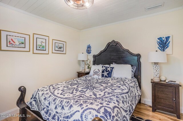 120 Swallow Rd, Saint Augustine, FL 32086 - bedroom with crown molding, wood finished floors, and baseboards