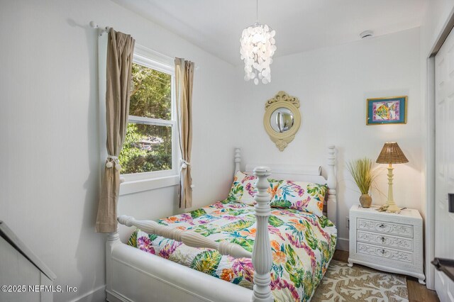 120 Swallow Rd, Saint Augustine, FL 32086 - bedroom featuring a chandelier