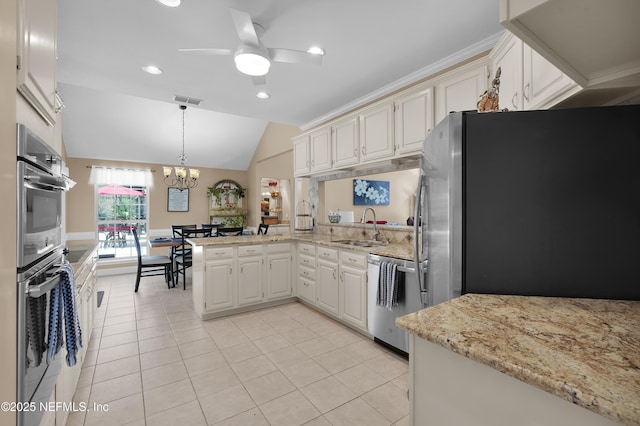 2072 Hawkcrest Dr E, Saint Johns, FL 32259 - kitchen featuring stainless steel appliances, a sink, a peninsula, ceiling fan, and lofted ceiling
