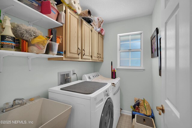2072 Hawkcrest Dr E, Saint Johns, FL 32259 - laundry area with cabinet space, washing machine and dryer, baseboards, and light flooring