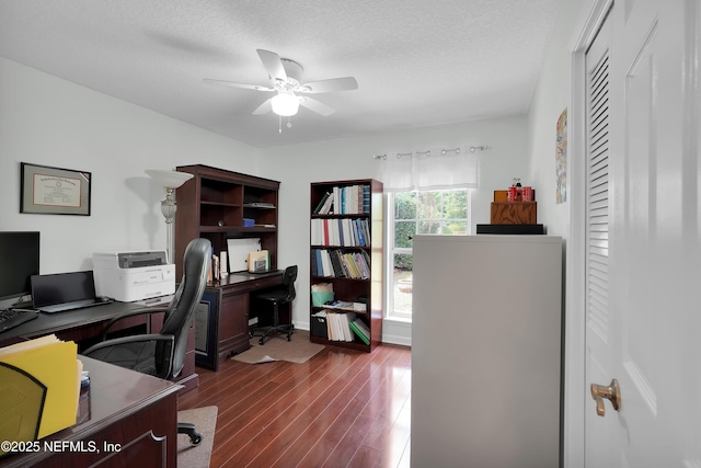 2072 Hawkcrest Dr E, Saint Johns, FL 32259 - home office with a ceiling fan, dark wood finished floors, a textured ceiling, and baseboards