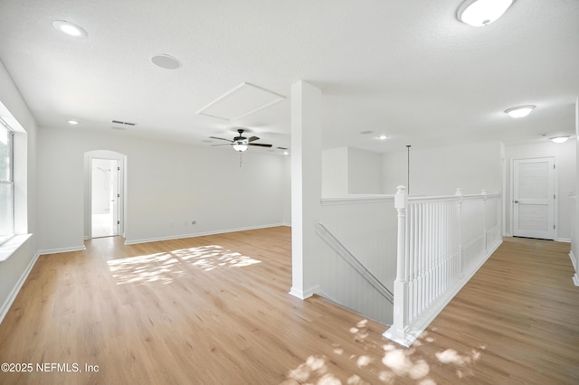 2012 Belle Grove Ter, Fleming Island, FL 32003 - unfurnished room with light wood-style floors, baseboards, recessed lighting, a ceiling fan, and arched walkways