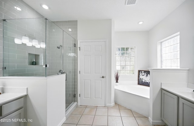 2012 Belle Grove Ter, Fleming Island, FL 32003 - bathroom with vanity, plenty of natural light, a shower stall, tile patterned flooring, and recessed lighting
