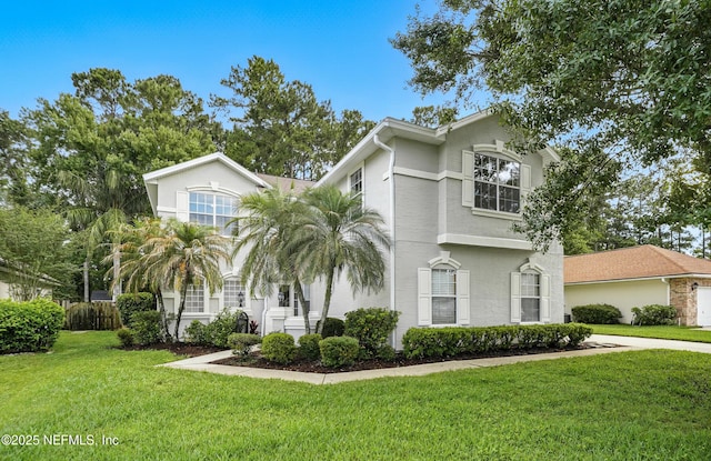 2012 Belle Grove Ter, Fleming Island, FL 32003 - view of front of home with stucco siding and a front lawn