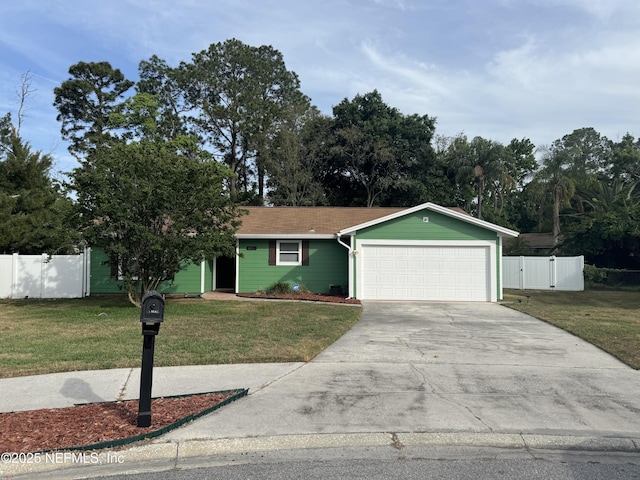 view of front facade with a garage, driveway, and a gate