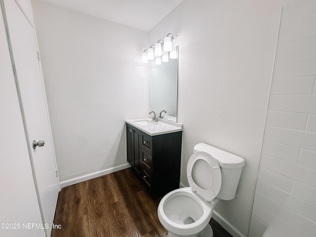 5201 Atlantic Blvd Unit 299, Jacksonville, FL 32207 - bathroom featuring wood finished floors, vanity, toilet, and baseboards