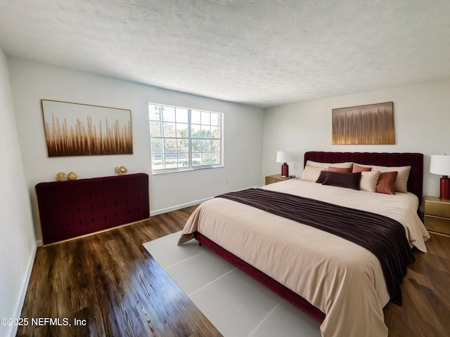5201 Atlantic Blvd Unit 299, Jacksonville, FL 32207 - bedroom featuring wood finished floors, baseboards, and a textured ceiling