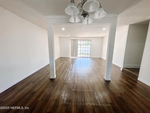 5201 Atlantic Blvd Unit 299, Jacksonville, FL 32207 - unfurnished dining area with dark wood finished floors, baseboards, a chandelier, and ornamental molding