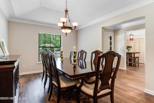 1835 Powder Springs Dr, Jacksonville, FL 32225 - dining area featuring wood finished floors, a tray ceiling, and ornamental molding
