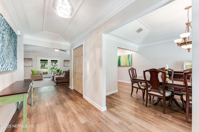 1835 Powder Springs Dr, Jacksonville, FL 32225 - dining space with wood finished floors, crown molding, a chandelier, and ceiling fan