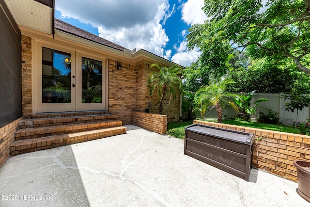 1835 Powder Springs Dr, Jacksonville, FL 32225 - fenced backyard featuring entry steps, a patio, and french doors