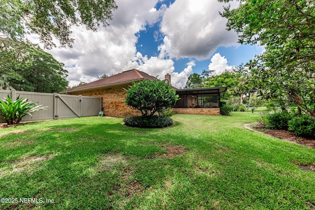 1835 Powder Springs Dr, Jacksonville, FL 32225 - view of yard with a gate and a sunroom