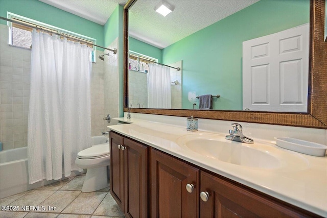 full bath with shower / bath combo, vanity, toilet, tile patterned flooring, and a textured ceiling