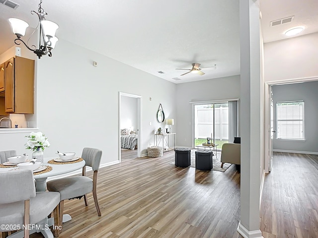 9421 Osprey Branch Trl Unit 2-3, Jacksonville, FL 32257 - dining area featuring light wood finished floors, a chandelier, baseboards, and ceiling fan