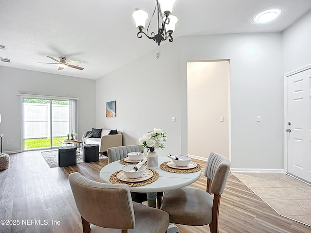 9421 Osprey Branch Trl Unit 2-3, Jacksonville, FL 32257 - dining space featuring light wood-style floors, a ceiling fan, baseboards, and a chandelier