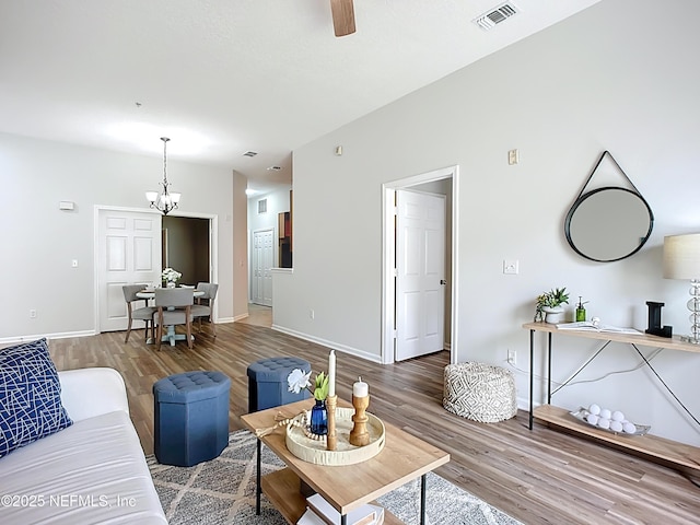 9421 Osprey Branch Trl Unit 2-3, Jacksonville, FL 32257 - living area featuring wood finished floors, a chandelier, a ceiling fan, and baseboards