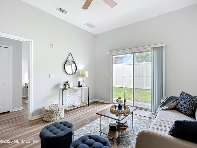 9421 Osprey Branch Trl Unit 2-3, Jacksonville, FL 32257 - living area with light wood-style floors, a ceiling fan, and baseboards