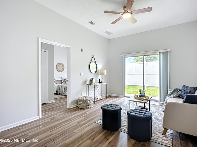 9421 Osprey Branch Trl Unit 2-3, Jacksonville, FL 32257 - living area featuring wood finished floors, a ceiling fan, and baseboards