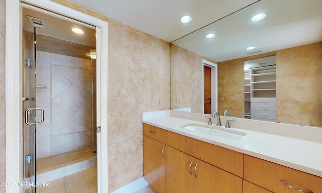 2100 Ocean Dr Unit Ph-2, Jacksonville Beach, FL 32250 - bathroom with vanity, recessed lighting, a shower stall, and a walk in closet