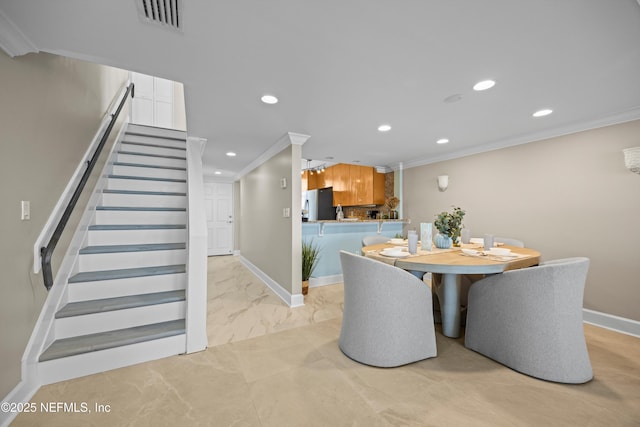 2100 Ocean Dr Unit Ph-2, Jacksonville Beach, FL 32250 - dining room featuring recessed lighting, ornamental molding, stairs, and light marble finish floors