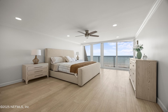 2100 Ocean Dr Unit Ph-2, Jacksonville Beach, FL 32250 - bedroom featuring crown molding, a water view, light wood-type flooring, a wall of windows, and recessed lighting