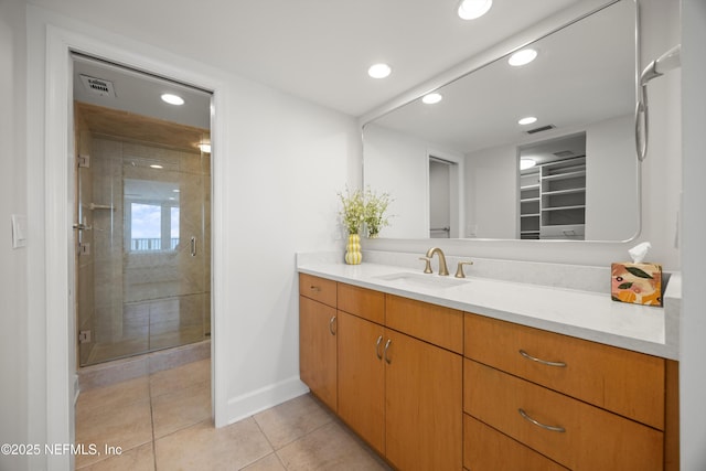 2100 Ocean Dr Unit Ph-2, Jacksonville Beach, FL 32250 - bathroom featuring vanity, a stall shower, recessed lighting, tile patterned flooring, and a walk in closet