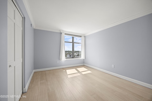 2100 Ocean Dr Unit Ph-2, Jacksonville Beach, FL 32250 - unfurnished bedroom featuring ornamental molding, light wood-type flooring, and a closet