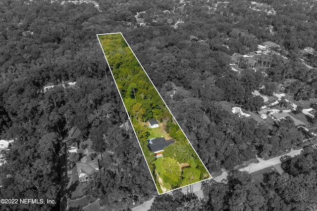 5092 Harvey Grant Rd, Fleming Island, FL 32003 - aerial view of property's location featuring a forest and property parcel outlined