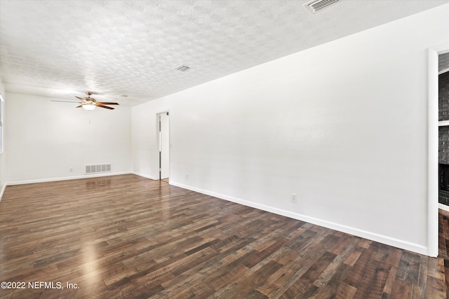 5092 Harvey Grant Rd, Fleming Island, FL 32003 - empty room with dark wood-style floors, ceiling fan, a textured ceiling, and baseboards