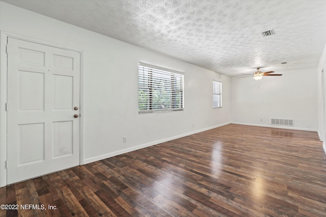 5092 Harvey Grant Rd, Fleming Island, FL 32003 - empty room with hardwood / wood-style floors, a textured ceiling, ceiling fan, and baseboards