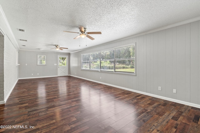 5092 Harvey Grant Rd, Fleming Island, FL 32003 - spare room with wood finished floors, a ceiling fan, a textured ceiling, ornamental molding, and baseboards