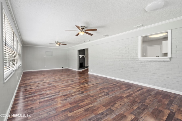 5092 Harvey Grant Rd, Fleming Island, FL 32003 - unfurnished room with wood finished floors, a textured ceiling, ceiling fan, brick wall, and baseboards