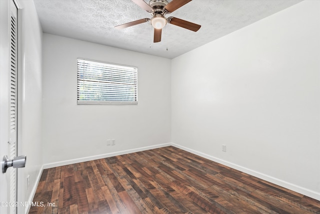 5092 Harvey Grant Rd, Fleming Island, FL 32003 - unfurnished room featuring dark wood-type flooring, baseboards, ceiling fan, and a textured ceiling