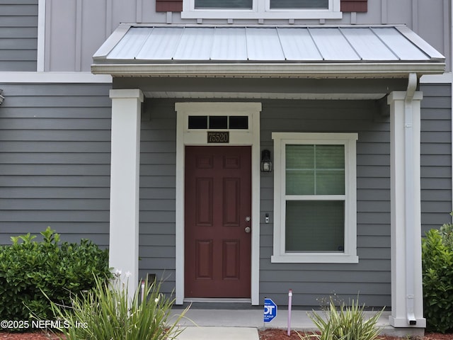75520 Harvester St, Yulee, FL 32097 - entrance to property with a standing seam roof, metal roof, and board and batten siding