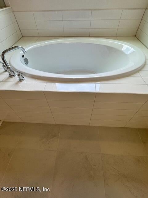 full bath with tile patterned floors and a garden tub