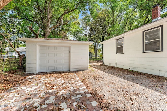 detached garage with concrete driveway