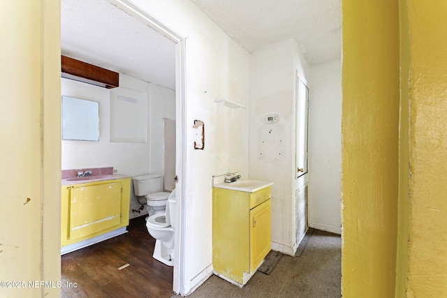 1403 Myrtle Ave N, Jacksonville, FL 32209 - bathroom with toilet, vanity, and wood finished floors