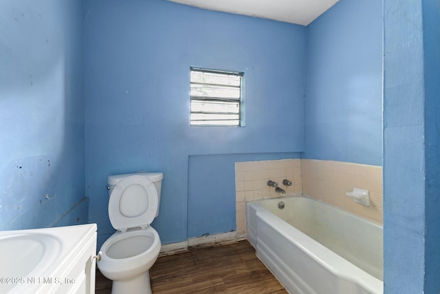 1403 Myrtle Ave N, Jacksonville, FL 32209 - bathroom featuring toilet, wood finished floors, and a garden tub