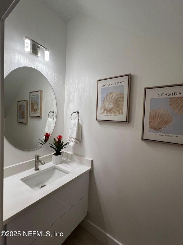 156 Capri Dr, Ormond Beach, FL 32176 - bathroom with vanity and baseboards