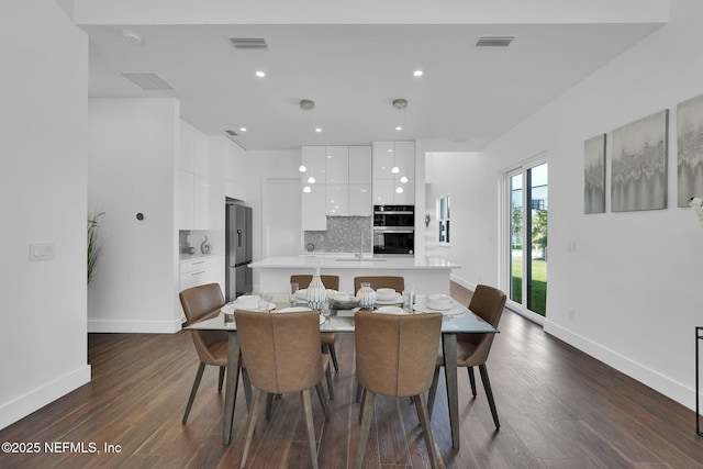 156 Capri Dr, Ormond Beach, FL 32176 - dining room with baseboards, dark wood-style flooring, and recessed lighting