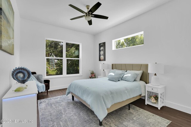 156 Capri Dr, Ormond Beach, FL 32176 - bedroom with baseboards, wood finished floors, and ceiling fan