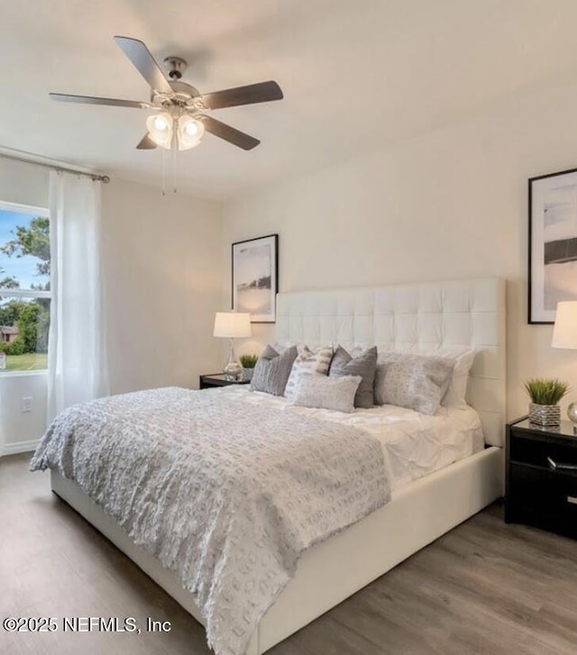 172 Reena Dr, Daytona Beach, FL 32117 - bedroom with wood finished floors and a ceiling fan