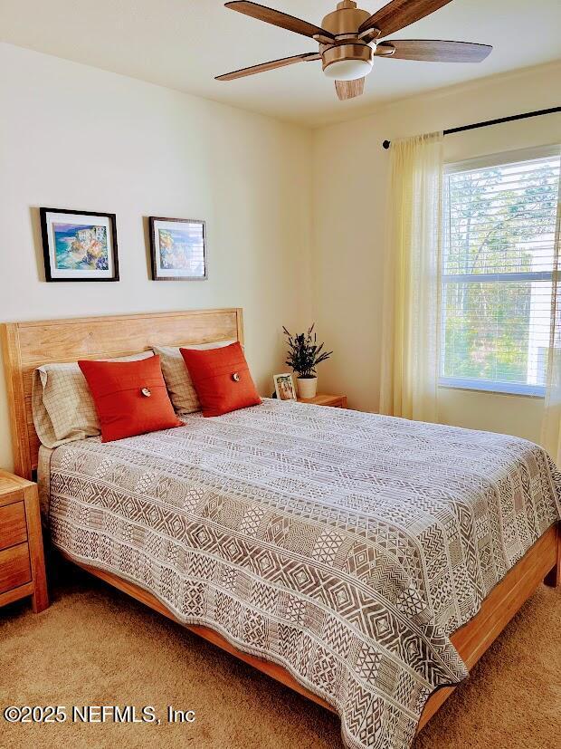 172 Reena Dr, Daytona Beach, FL 32117 - carpeted bedroom with a ceiling fan