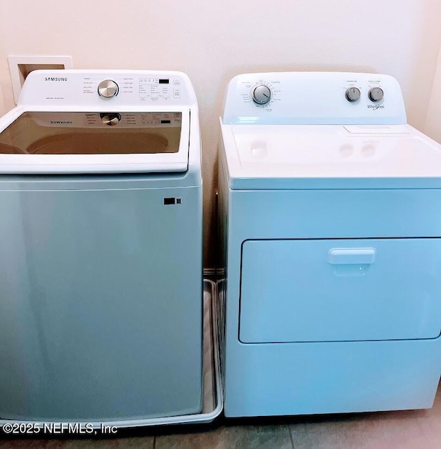172 Reena Dr, Daytona Beach, FL 32117 - clothes washing area featuring independent washer and dryer