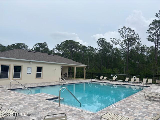 172 Reena Dr, Daytona Beach, FL 32117 - community pool featuring fence and a patio